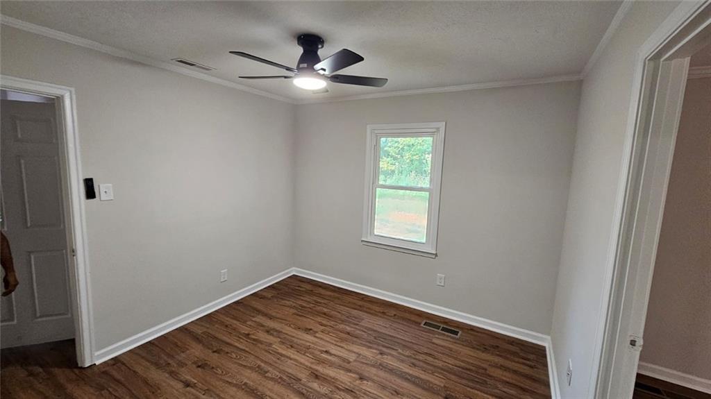 471 Perkins Circle Canton, GA 30115 - Photo 16 of 20 a view of a room with wooden floor and a window