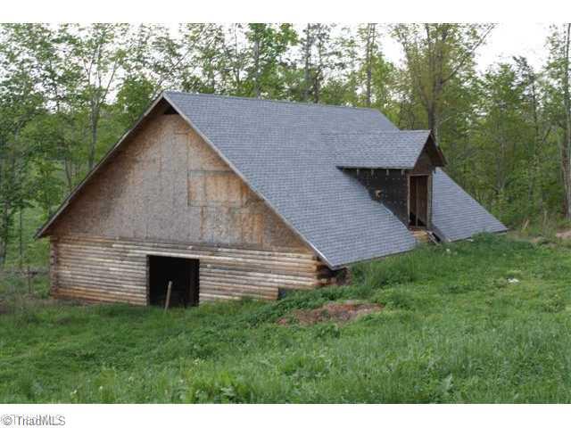 544 Reely Cook Road Dobson, NC 27017 - Photo 2 of 16 Outbuilding. Horse or cattlle barn.