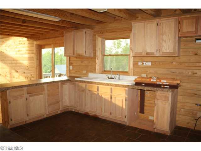544 Reely Cook Road Dobson, NC 27017 - Photo 5 of 16 Kitchen. Kitchen with great wooden caabinets.