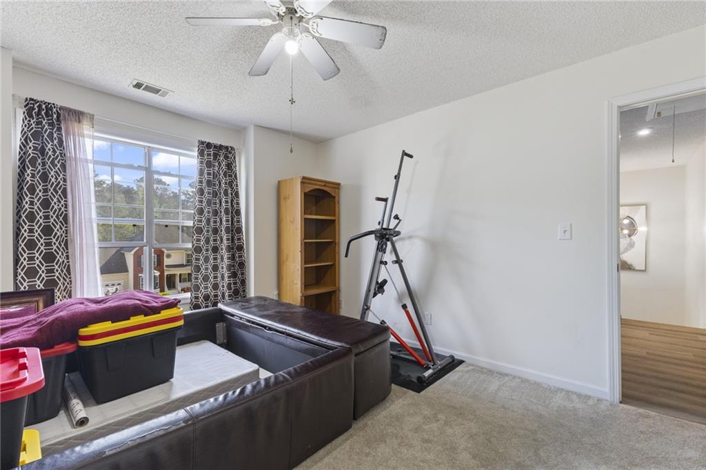 4008 Lindsey Lane Rex, GA 30273 - Photo 19 of 34 a room with gym equipment and a window