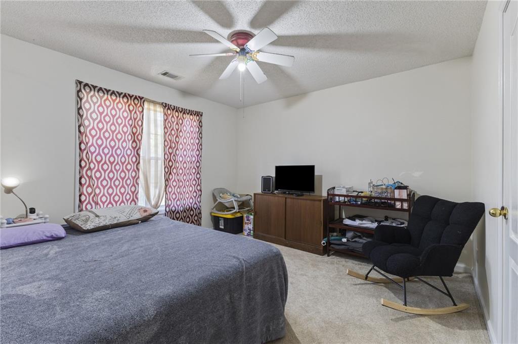4008 Lindsey Lane Rex, GA 30273 - Photo 20 of 34 a bedroom with a bed and a television