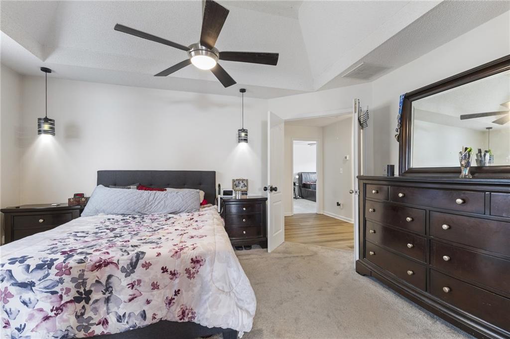 4008 Lindsey Lane Rex, GA 30273 - Photo 23 of 34 a bedroom with a bed and a dresser