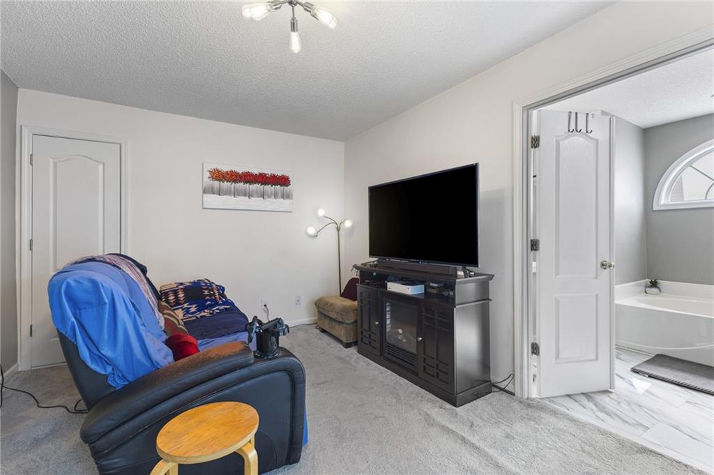 4008 Lindsey Lane Rex, GA 30273 - Photo 24 of 34 a living room with furniture and a flat screen tv