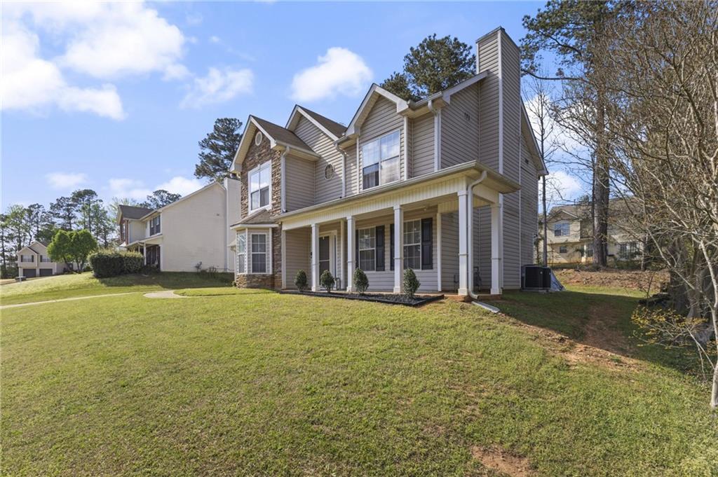 4008 Lindsey Lane Rex, GA 30273 - Photo 3 of 34 a view of a house with a garden