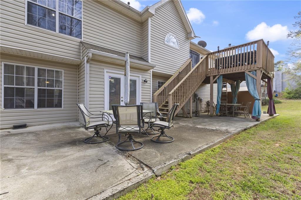 4008 Lindsey Lane Rex, GA 30273 - Photo 32 of 34 a view of a house with backyard and sitting area