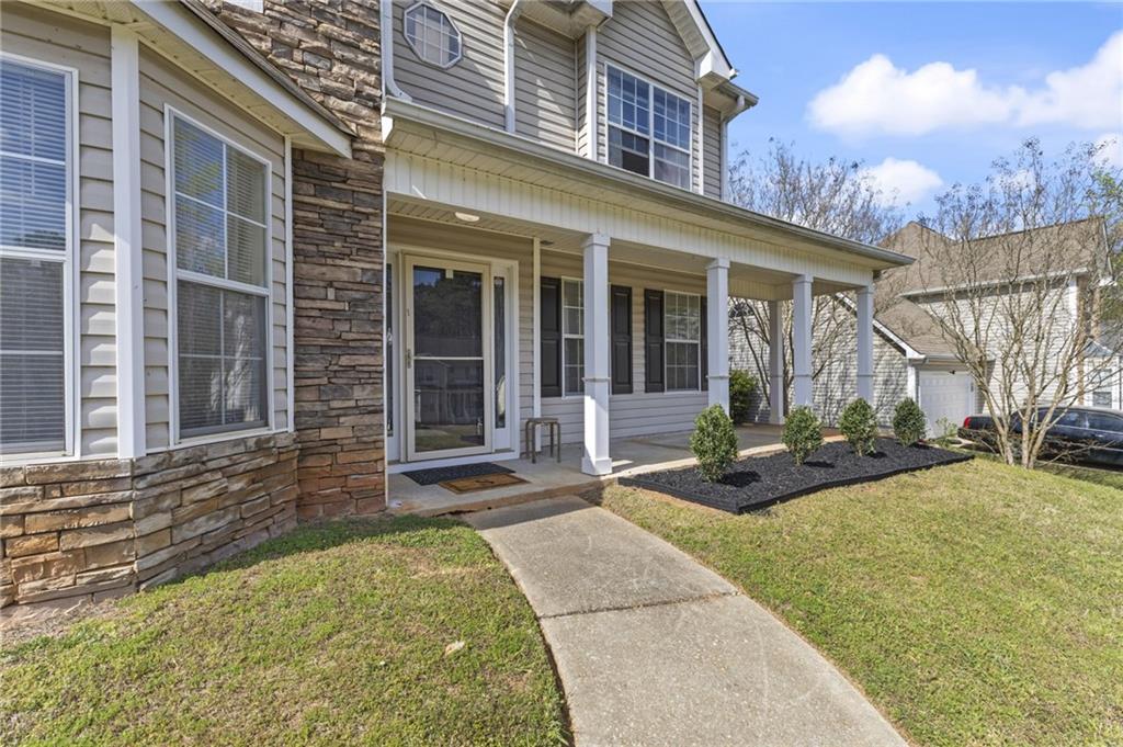 4008 Lindsey Lane Rex, GA 30273 - Photo 4 of 34 a view of a building with a outdoor space