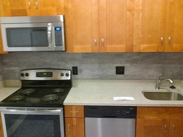 a kitchen with a sink and a stove