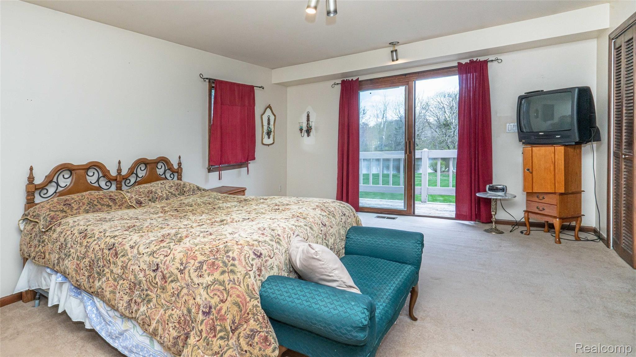 5330 Inverrary Lane Commerce Township, MI 48382 - Photo 58 of 76 Large master bedroom with balcony.