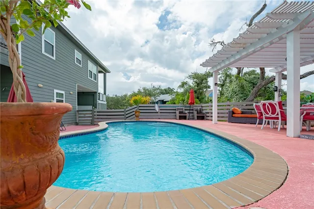a view of a swimming pool with a patio