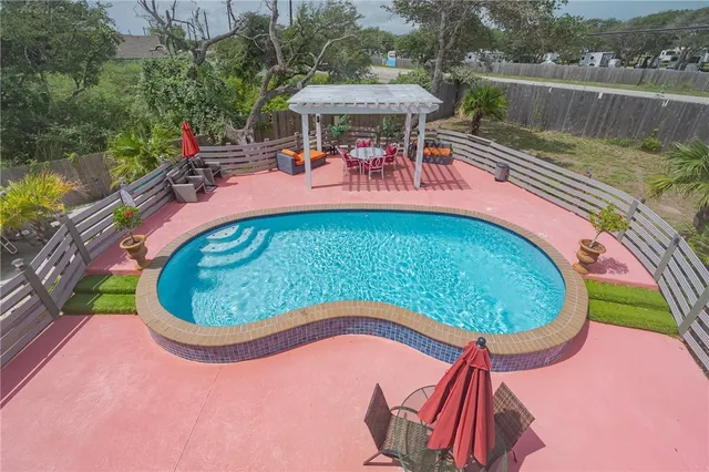 an outdoor sitting area with furniture