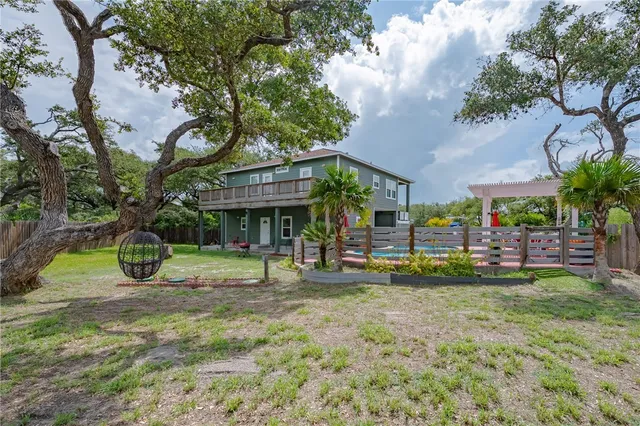a view of a house with a yard porch and sitting area