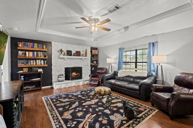 a kitchen with stainless steel appliances kitchen island granite countertop a refrigerator and a stove