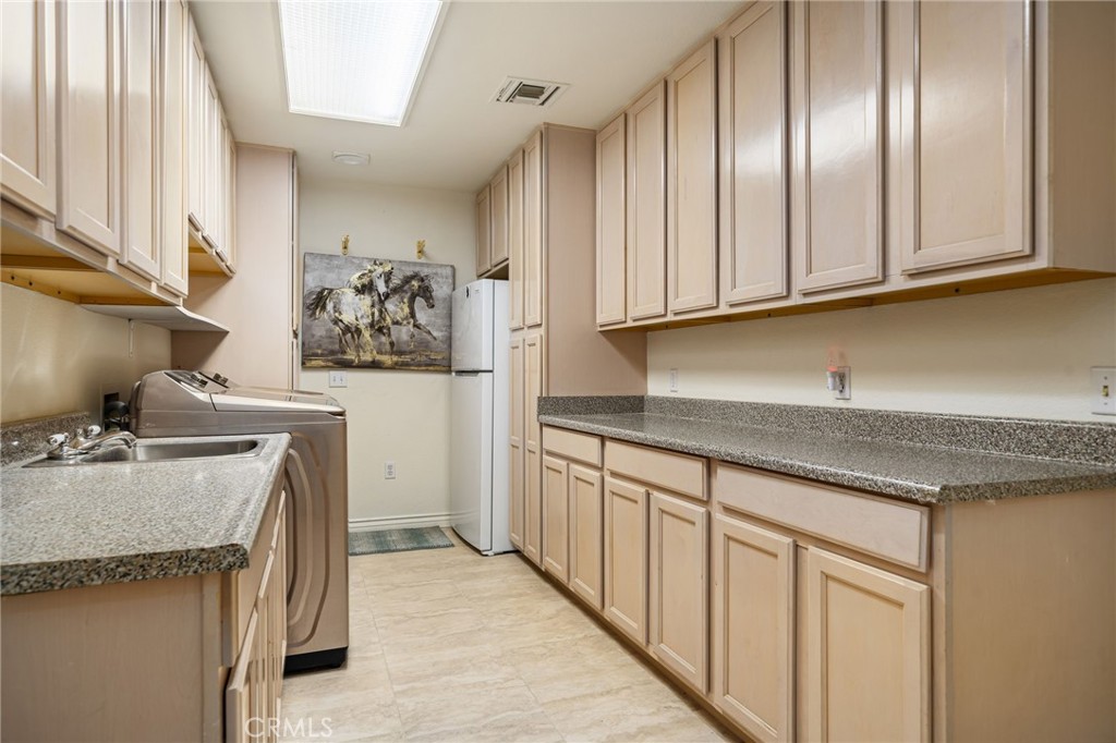 120 Old Ranch Road Palm Desert, CA 92211 - Photo 28 of 50 Large Laundry/Utility room off of garage