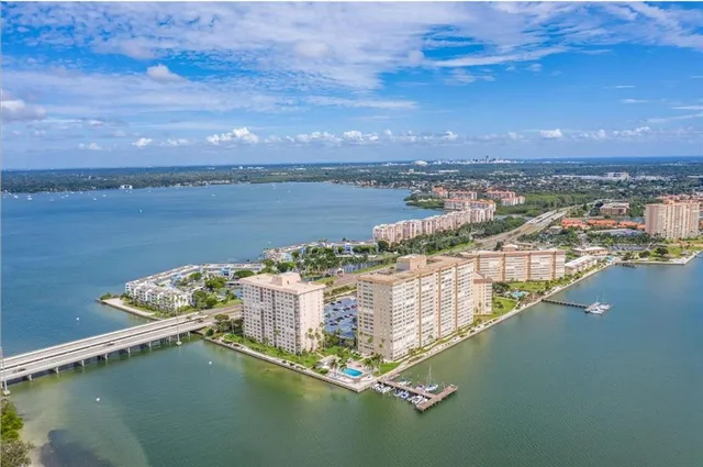 a patio with a table and chairs under an umbrella