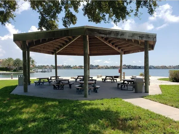 a view of a swimming pool with outdoor seating