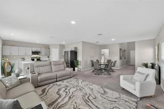 a view of a kitchen with sink stove and refrigerator