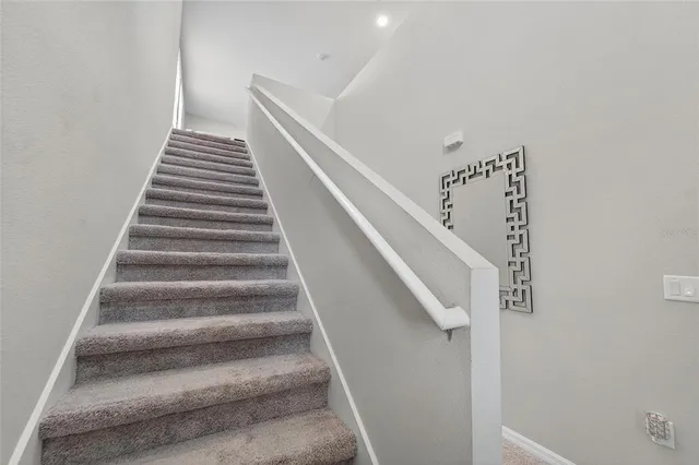 a bathroom with a sink double vanity granite and a mirror