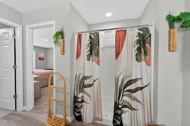 a en suite bathroom with a sink and a mirror