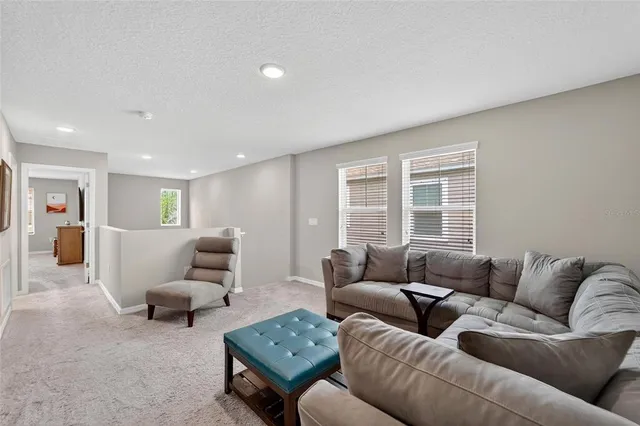 an aerial view of residential houses with outdoor space and river