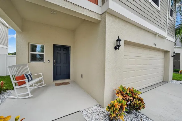 a view of a hallway with wooden floor and entryway