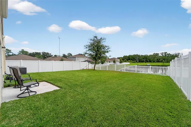 a outdoor living space with furniture and a potted plant