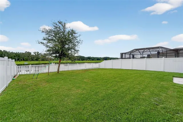 a view of a swimming pool with an outdoor space and seating area