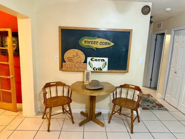 a kitchen with stainless steel appliances a cabinets and a book shelf