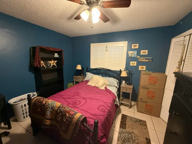 a white toilet sitting next to a bathroom sink and a shower