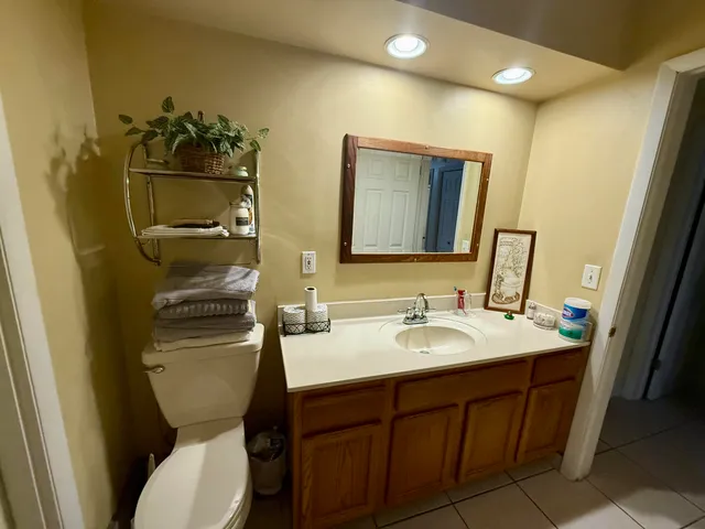 a bathroom with a shower and a glass door