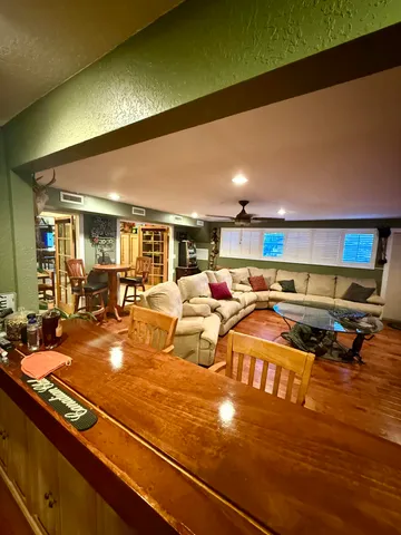 a balcony with table and chairs