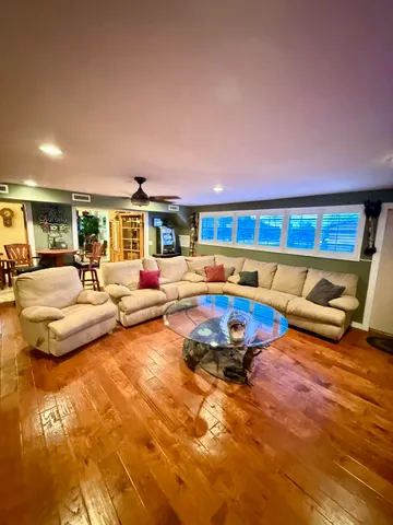 a room with furniture and a flat screen tv