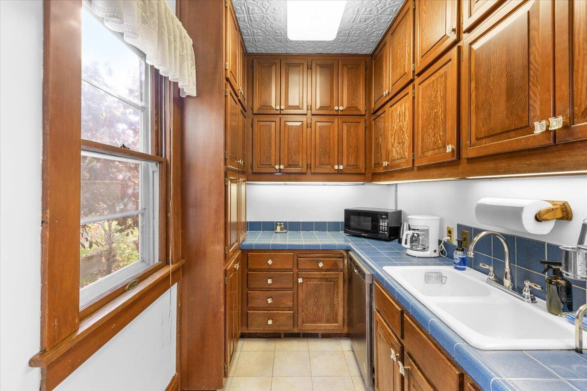 139 Southwest I Street Grants Pass, OR 97526 - Photo 20 of 47 a kitchen with stainless steel appliances granite countertop a sink and a refrigerator