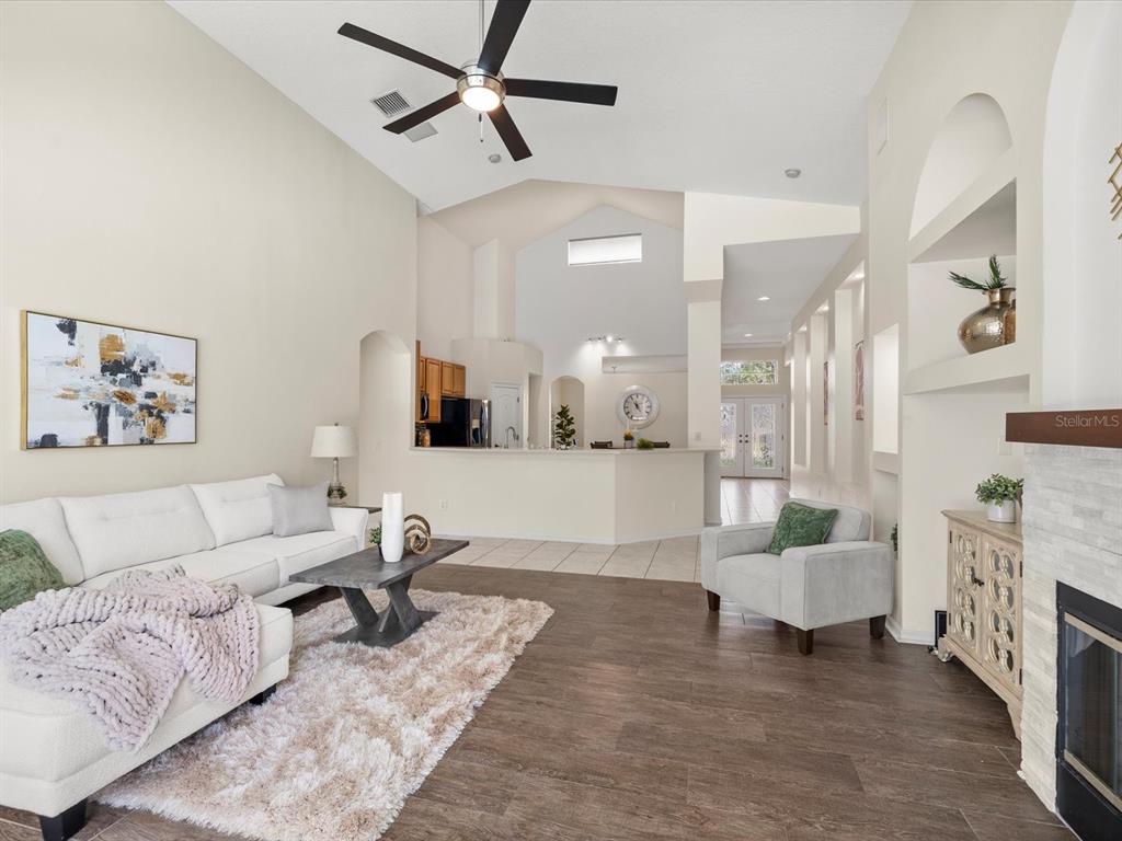 7935 Calindra Court Trinity, FL 34655 - Photo 17 of 52 a living room with furniture and a couch