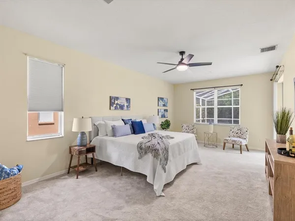 a bedroom with a large bed and a window