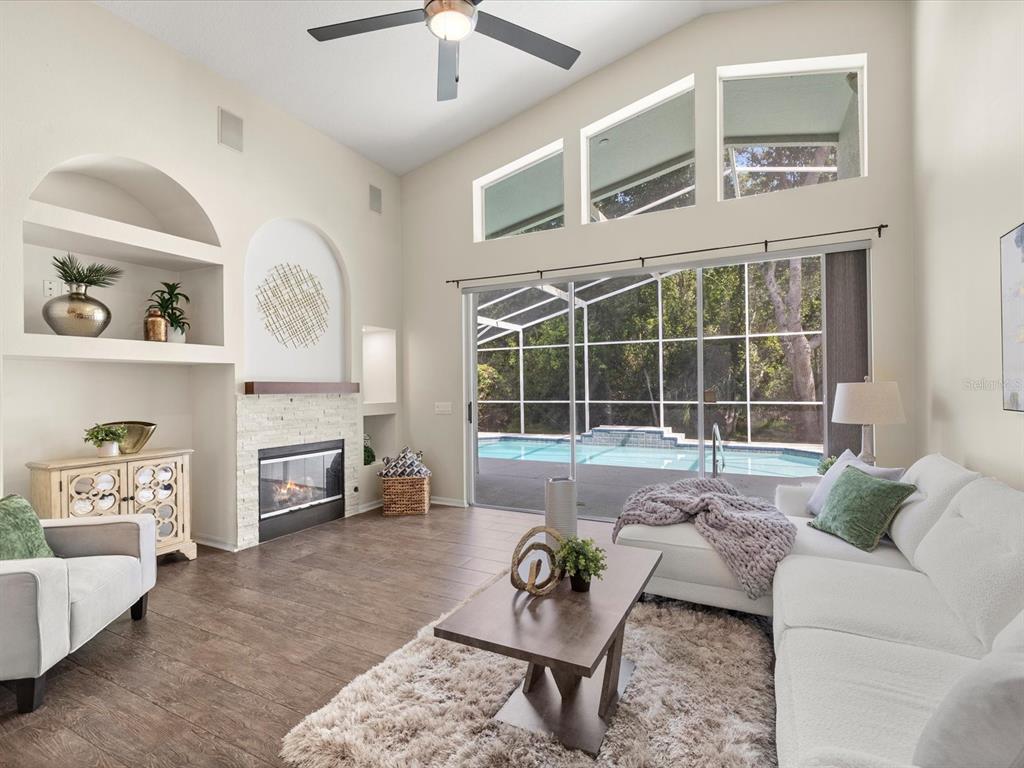 7935 Calindra Court Trinity, FL 34655 - Photo 2 of 52 a living room with furniture and a large window