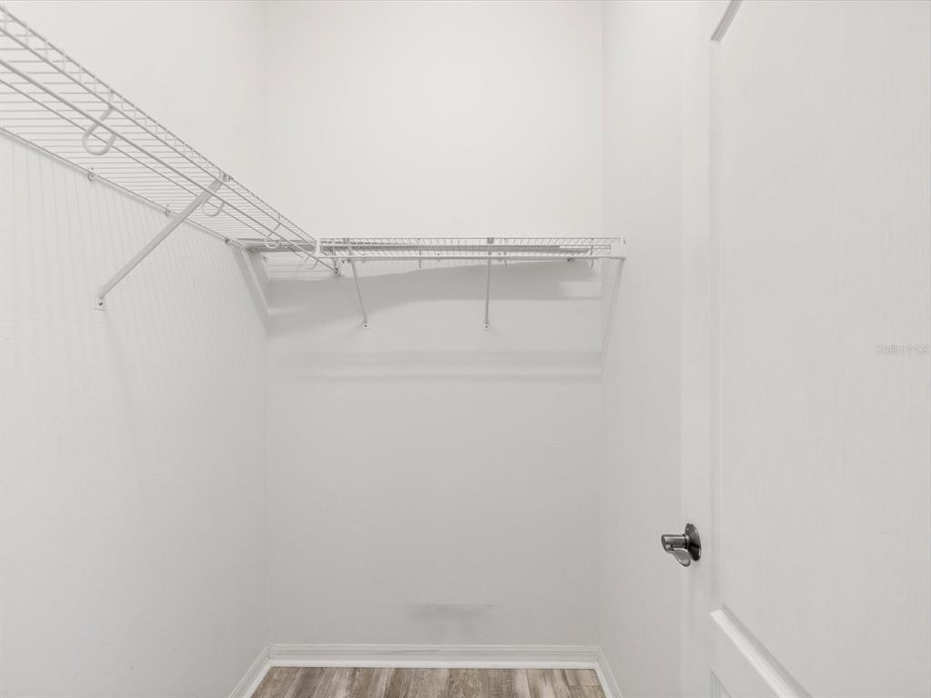 7935 Calindra Court Trinity, FL 34655 - Photo 27 of 52 a view of small space with racks on the wall