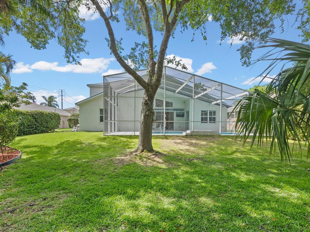 7935 Calindra Court Trinity, FL 34655 - Photo 40 of 52 a view of a house with a yard