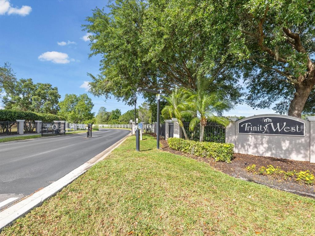 7935 Calindra Court Trinity, FL 34655 - Photo 45 of 52 a view of a street with a building and a street sign