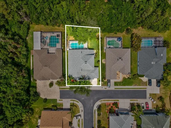 an aerial view of a house with outdoor space