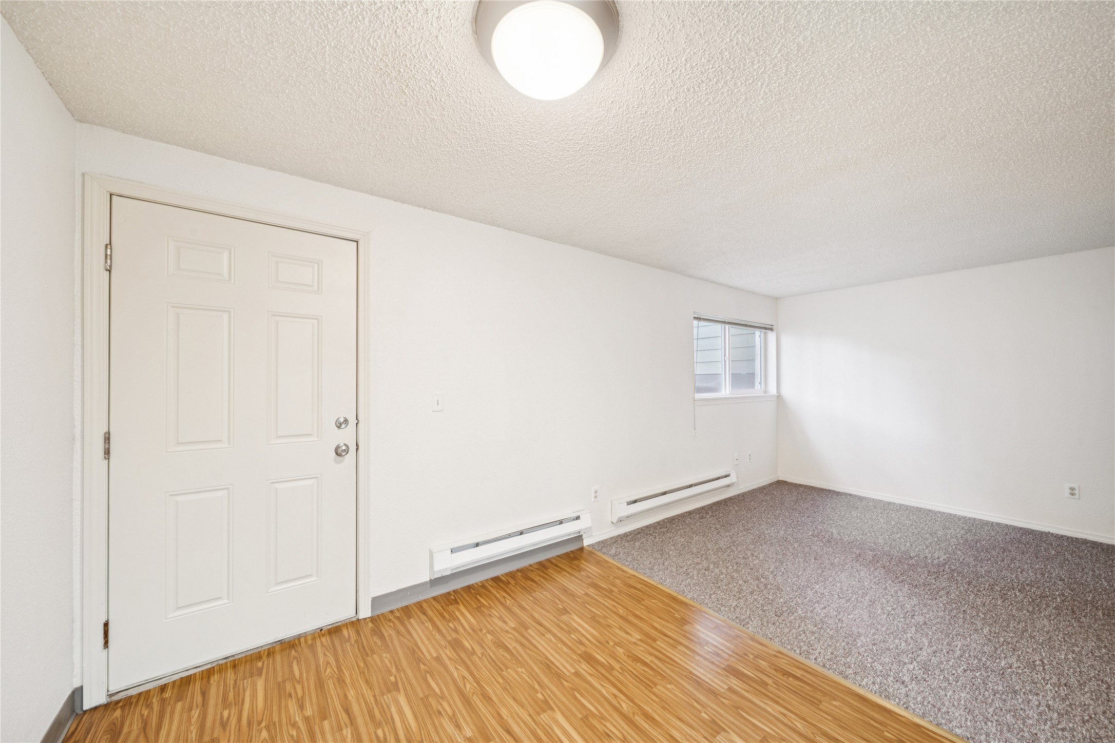 2610 Mill Bay Road Other, AK 99615 - Photo 30 of 50 an empty room with wooden floor and windows
