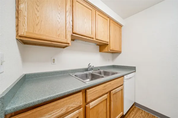 a kitchen with stove and cabinets
