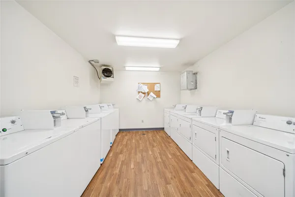 a view of a house with a patio and a yard