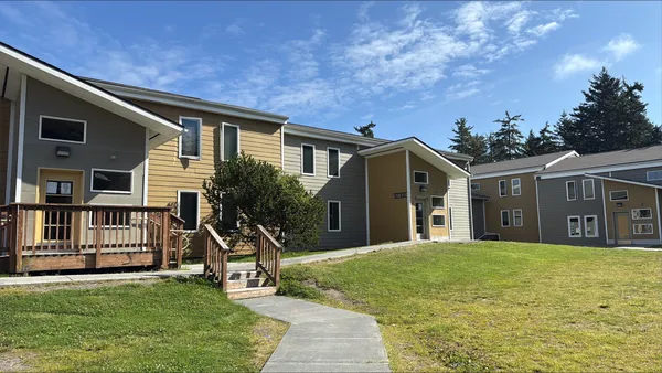 a view of multiple house with a yard