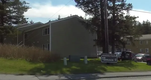 a aerial view of a house with a yard
