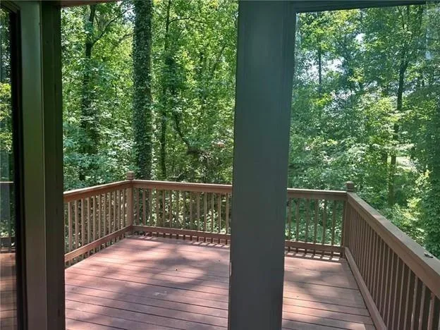 a view of balcony with wooden floor