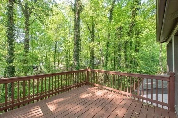 a view of balcony with wooden floor
