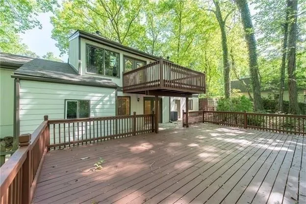 a view of a house with a yard and wooden floor