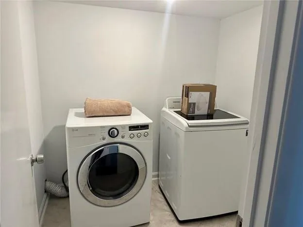a utility room with dryer and washer