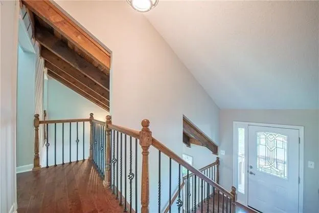 a view of staircase with rug