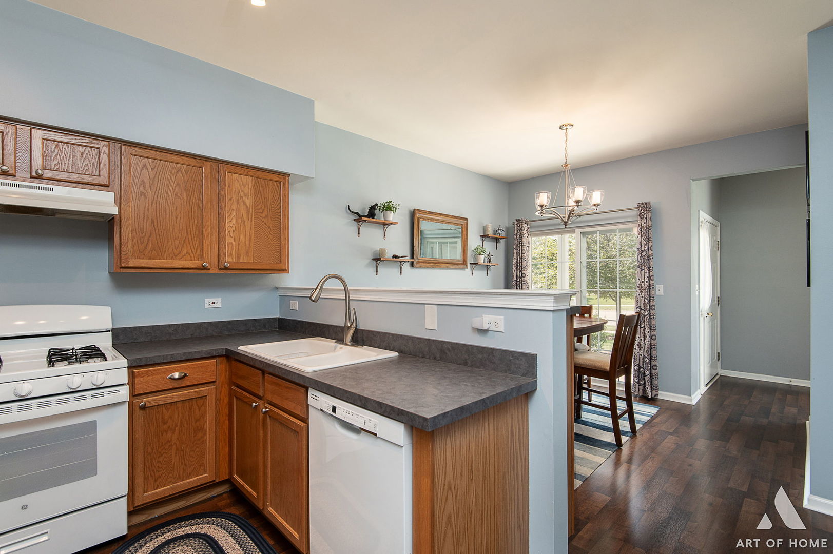169 Braxton Lane Aurora, IL 60504 - Photo 11 of 26 a kitchen with a sink cabinets and wooden floor